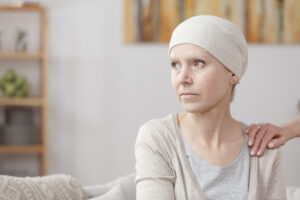 Sad,Sick,Woman,With,Lung,Cancer,Sitting,At,Home,With